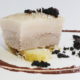 Poached pork belly, coconut and black pudding vinaigrette, black pudding crumble